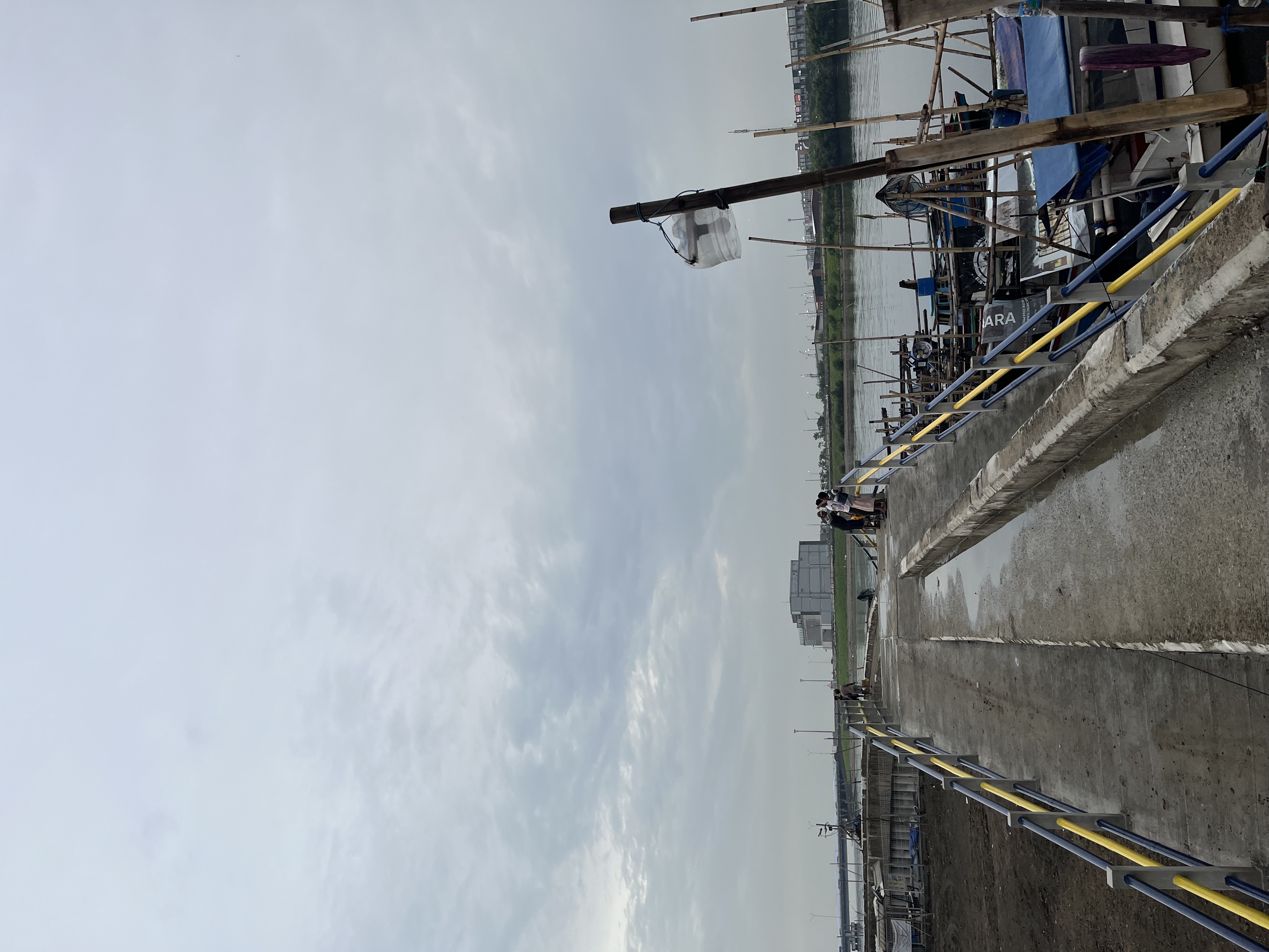 View from Kamal Muara toward the PIK luxury development across the water channel that youth swim across